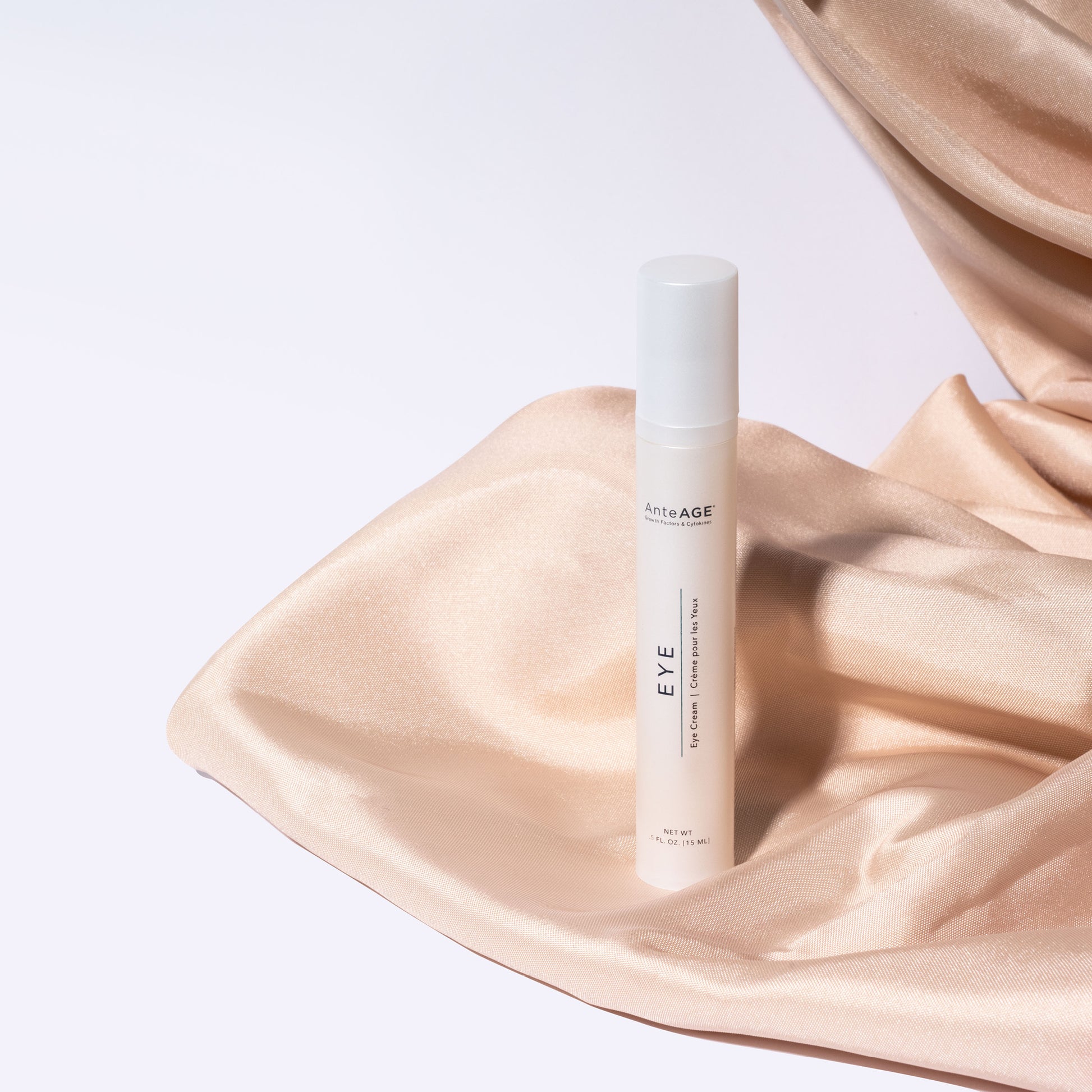 AnteAGE Skincare bottle labeled 'EYE' on a soft fabric background