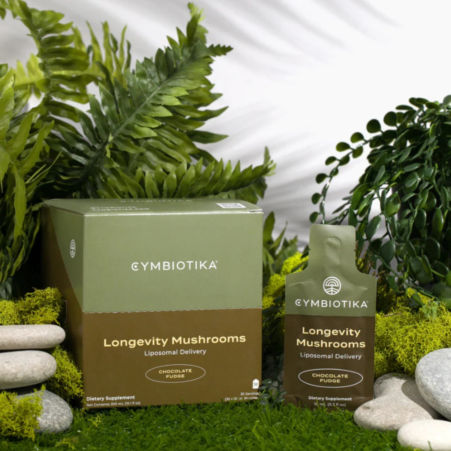 Cymbiotika Longevity Mushrooms packaging with plants and stones in the background