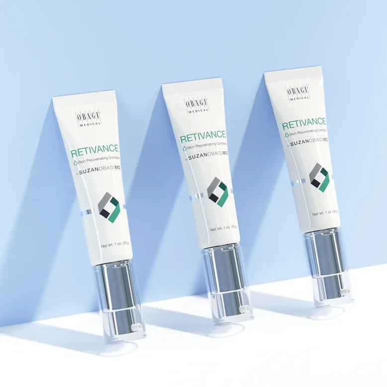 Three tubes of Orage Retivance serum on a light blue background