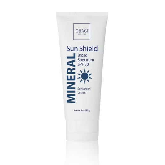 A tube of Obagi Mineral Sun Shield Broad Spectrum SPF 50 sunscreen lotion.