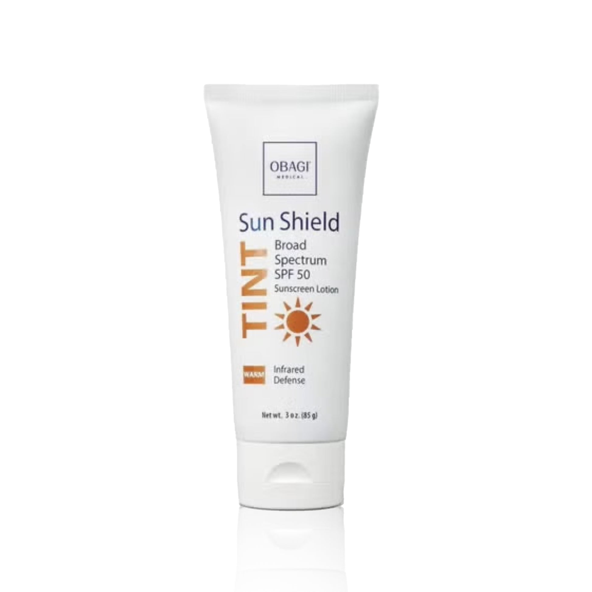 A tube of Obagi Tinted Sun Shield SPF 50 with a warm tone, packaged in a white casing with product details.