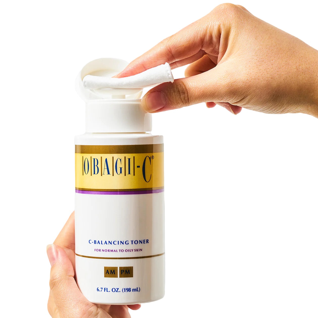 Hand holding a bottle of JoBaugh-C C-Balancing Toner with a white background