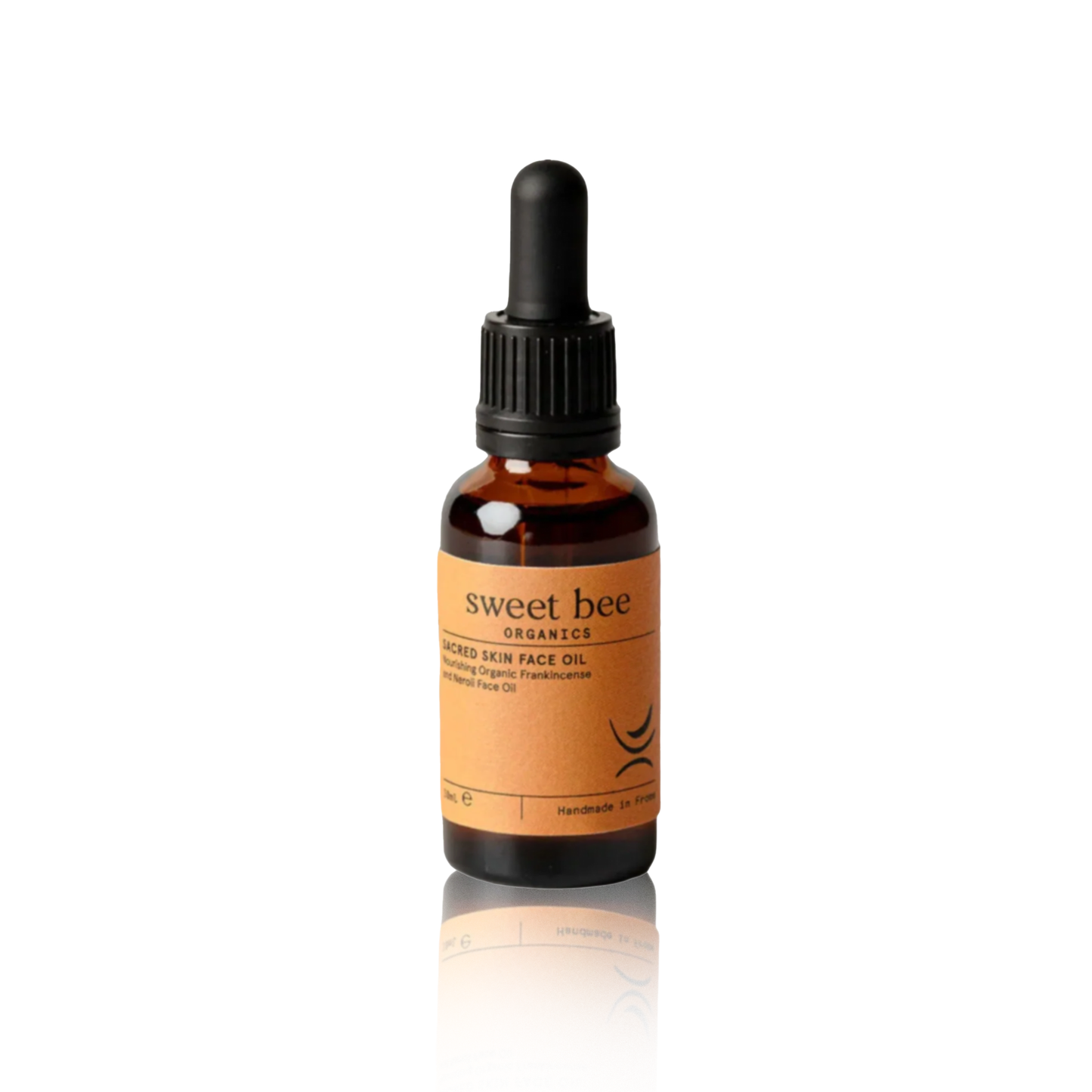 Bottle of sweet bee Organics face oil on a white background