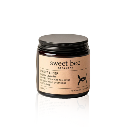 Jar of 'Sweet Bee Organics' sweet sleep product on a beige background