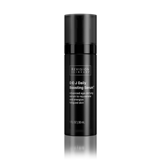 Black skincare serum bottle with 'Revision Skincare' branding on a white background