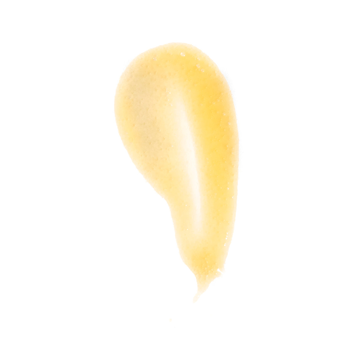Yellow lip balm smear on a white background
